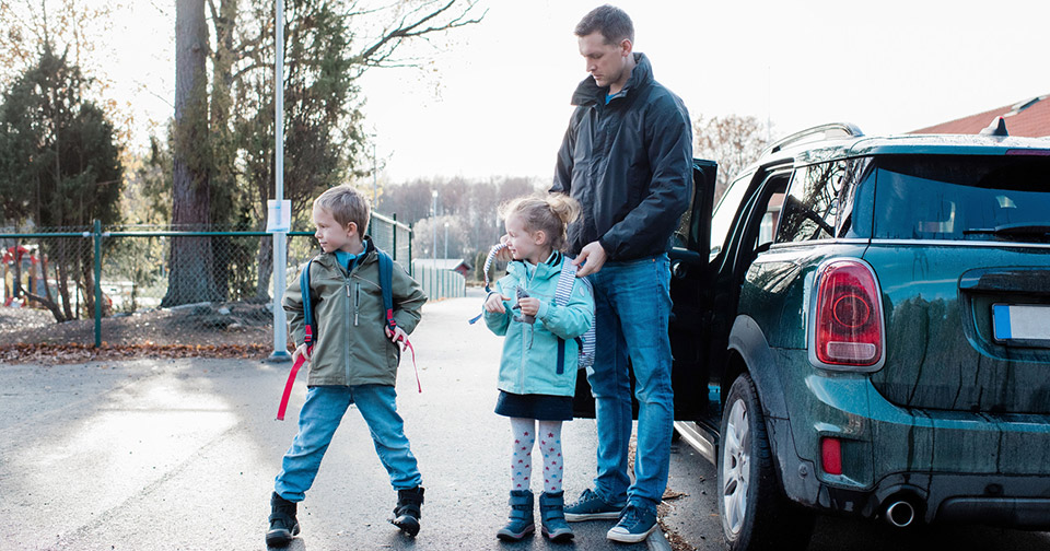 Father dropping kids at school