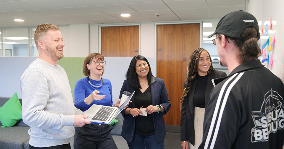 Colleagues laughing in a group