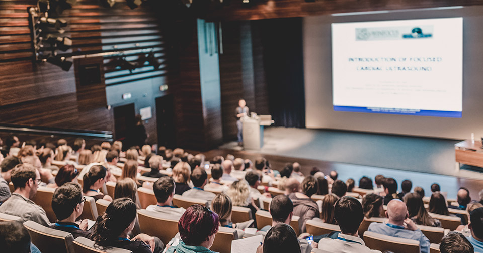 image of a conference or speaker event